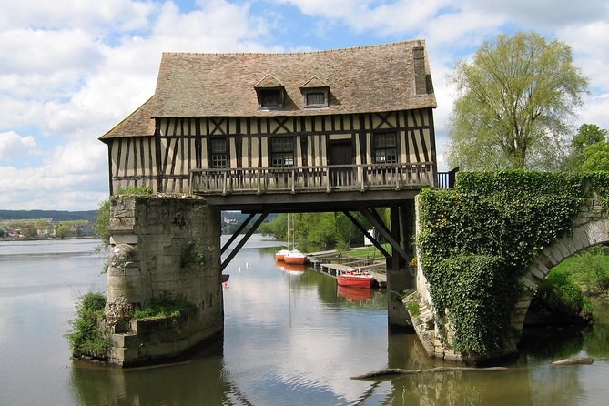 The old timber mill standing on its stone piers in the Seine at Vernon